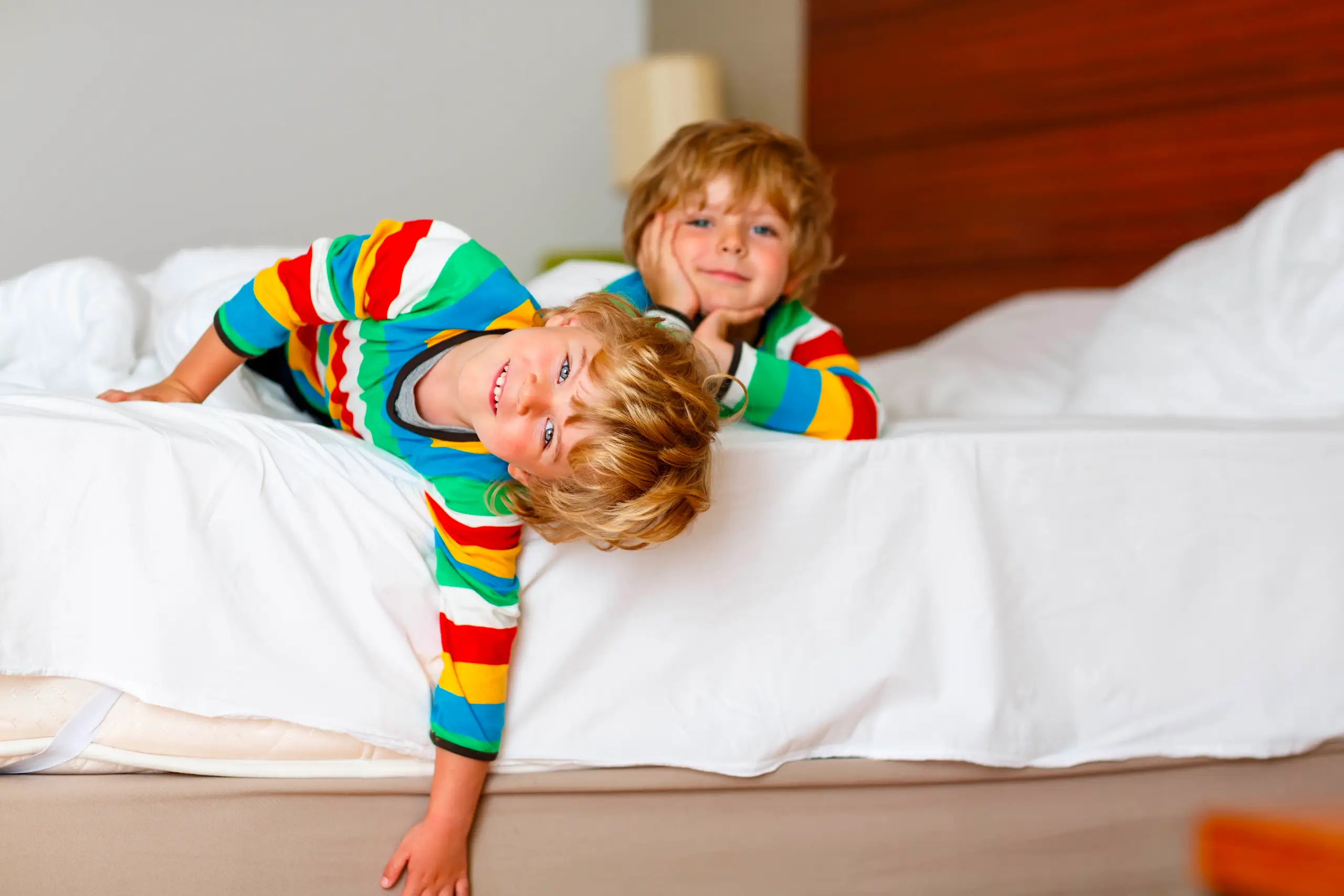 Kids in matching pajamas laying on a bed - Don't let bed bugs infest your bed with Seitz Bros Pest Control in Tamaqua, PA 